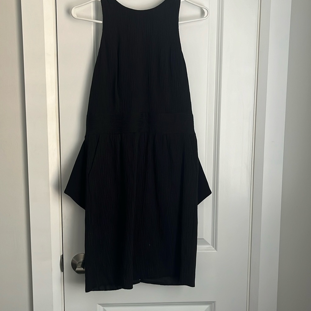 Black BCBG dress with ruffle detail on the lower back
